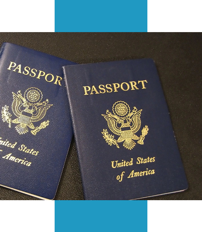 Two passports sitting on top of a table.